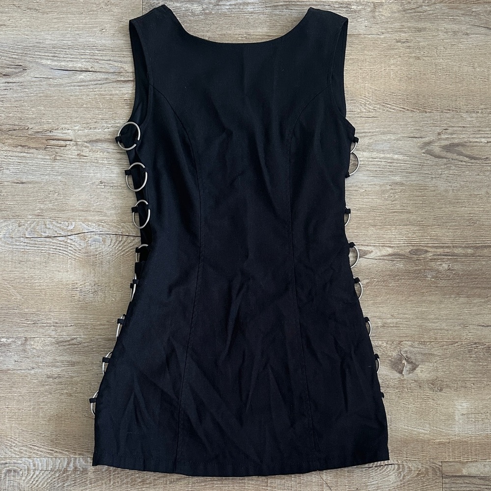Chic Black Dress with Side Ring Accents